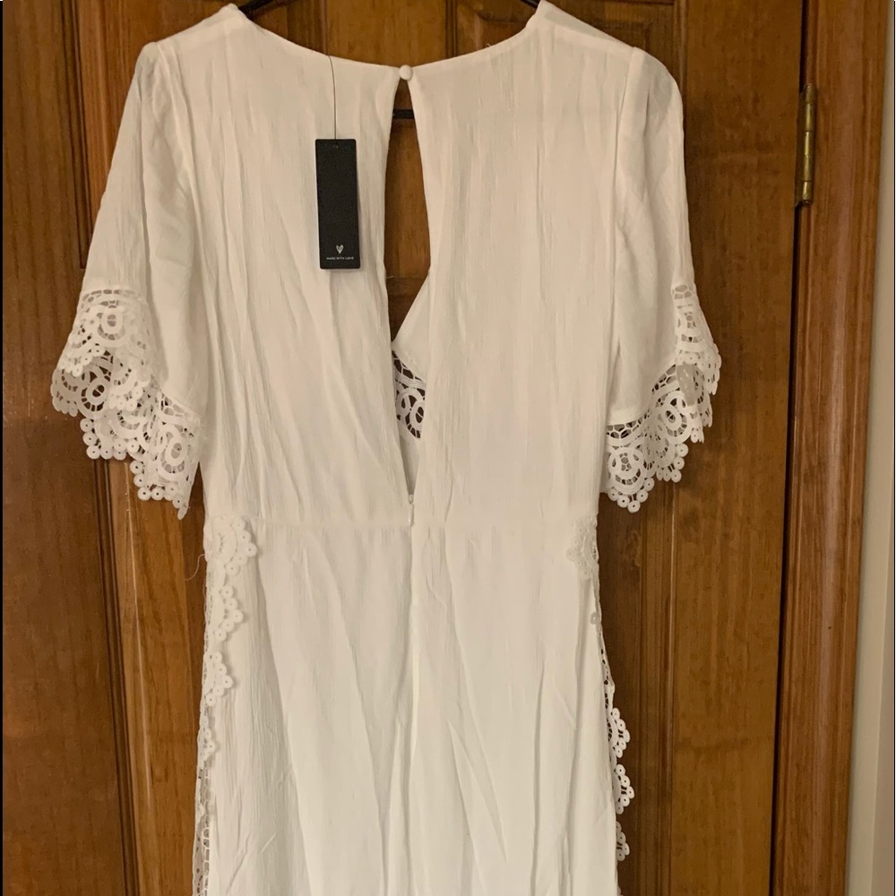Brand new dress never worn. Still has tags. Beautiful bohemian white maxi dress